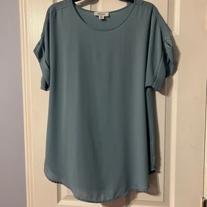 Gently worn blue sheer shirt